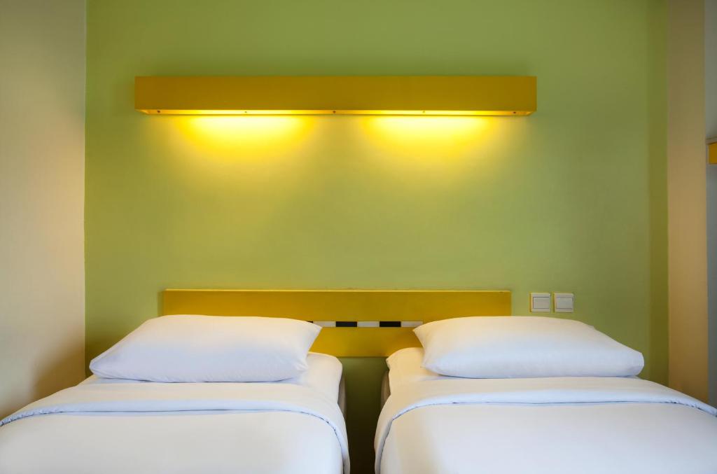 Postel nebo postele na pokoji v ubytování Ibis Budget Jakarta Menteng