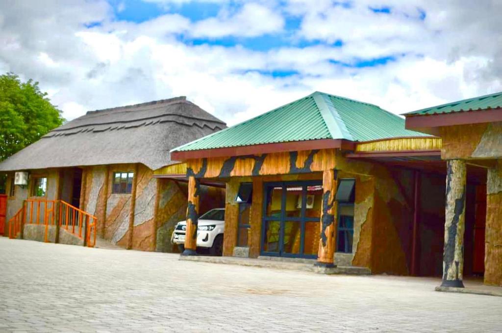 a building with a car parked in front of it at Makgadikgadi Riverview Inn in Nata