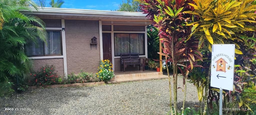 a small house with a sign in front of it at The Bees House in Fortuna