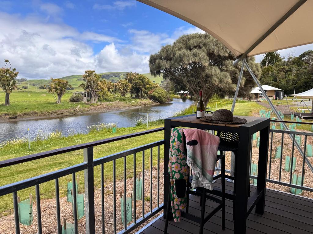 a balcony with a view of a river at Apollo Bay Recreation Reserve in Apollo Bay