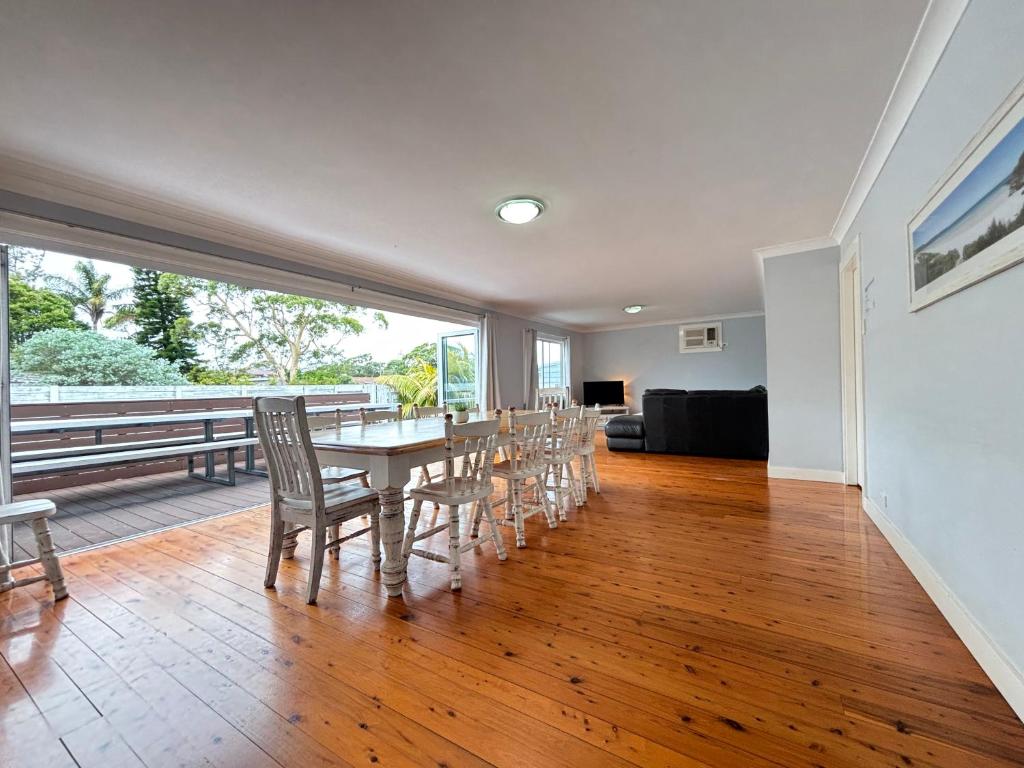 a dining room with a table and chairs at Watts @ Callala Beach-Pet Friendly in Callala Beach