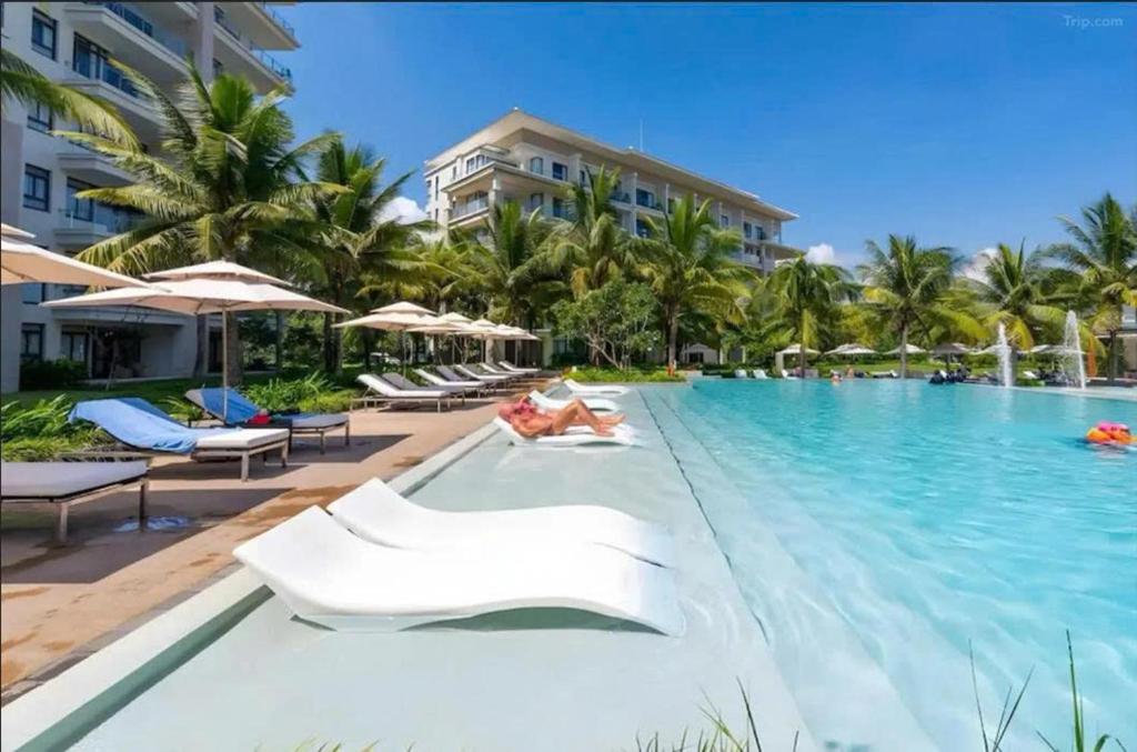 a pool at the resort at Diamond Beach Villa Da Nang in Danang