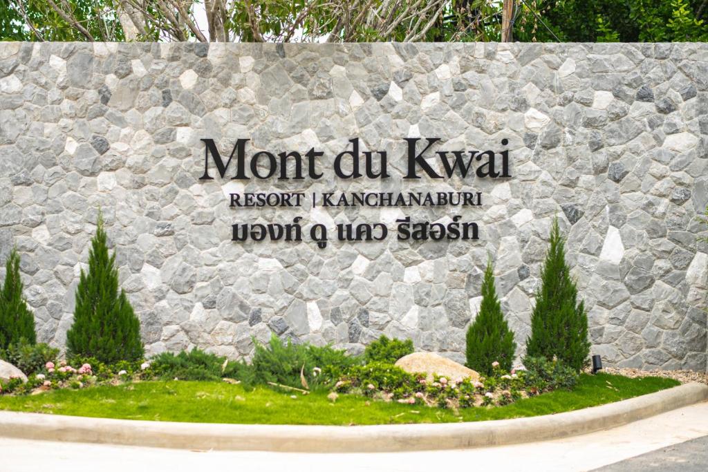 a sign for the front of a stone wall at Mont Du Kwai Resort in Ban Yang (2)