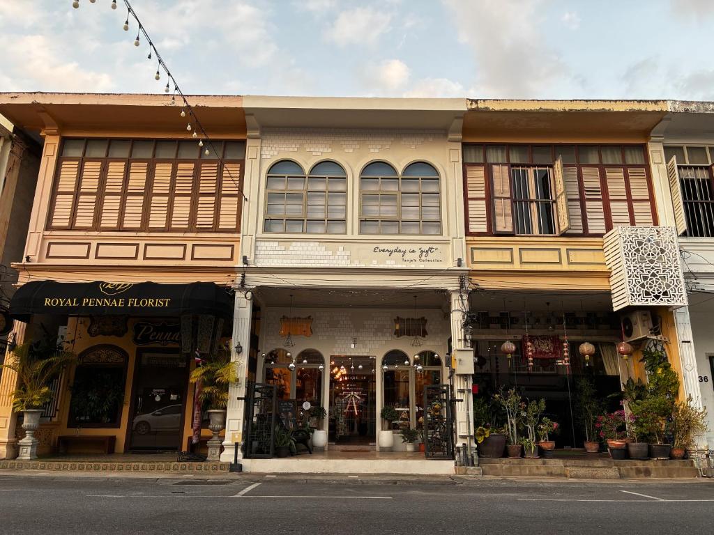 a building on the side of a street at Village 40 Phuket Old Town in Phuket