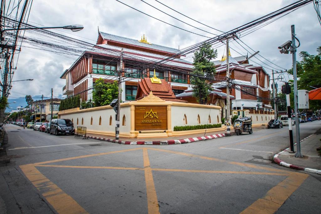 a building on the side of a street at Villa Sirilanna Hotel in Chiang Mai