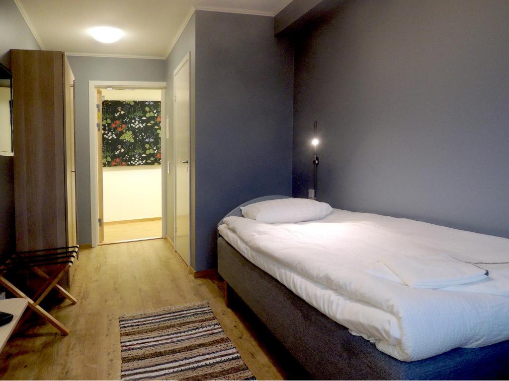 Postel nebo postele na pokoji v ubytování Hotell Munkeröd