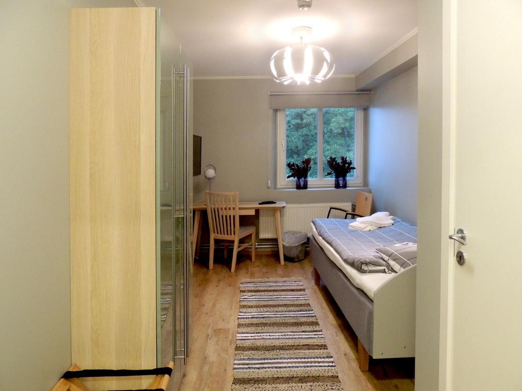 Postel nebo postele na pokoji v ubytování Hotell Munkeröd