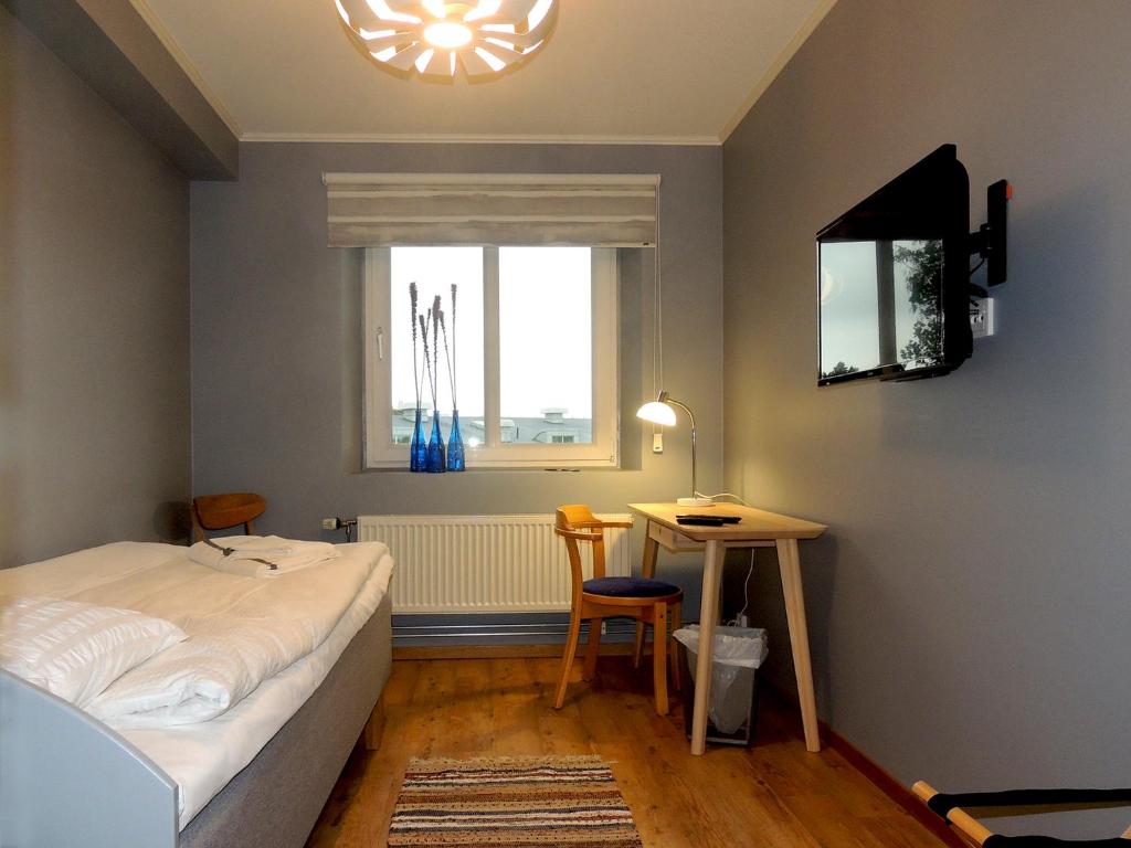 Postel nebo postele na pokoji v ubytování Hotell Munkeröd