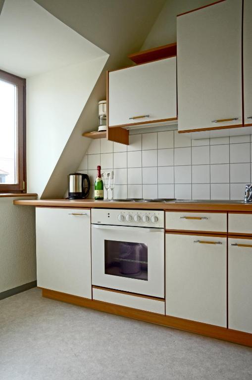Kuchyň nebo kuchyňský kout v ubytování Hotel & Apartments Fürstenhof am Bauhaus
