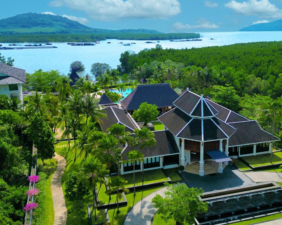 an aerial view of a house with trees and water at BB Luxury Villa in Phuket