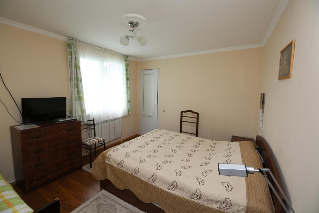 Postel nebo postele na pokoji v ubytování Guest House Green House
