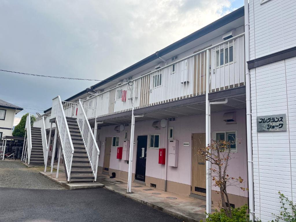 a building with stairs on the side of it at フレグランスショーワ in Matsue