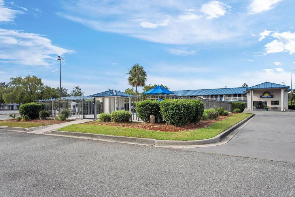 a parking lot in front of a building at Days Inn by Wyndham Valdosta I-75 in Valdosta