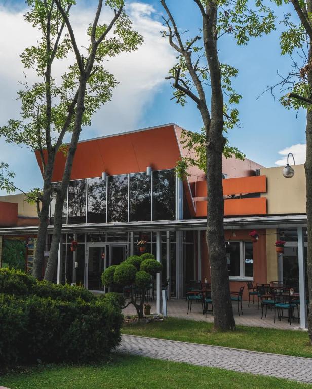 an exterior view of a building with trees at Diament in Nowa Ruda