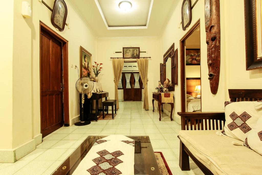 Postel nebo postele na pokoji v ubytování Griya Langen Guesthouse