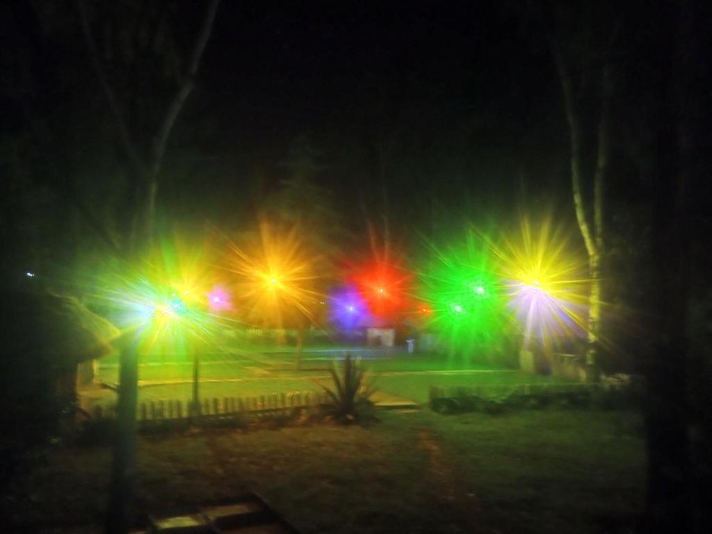 a group of street lights in a park at night at Sirimon Base Camp in Nanyuki