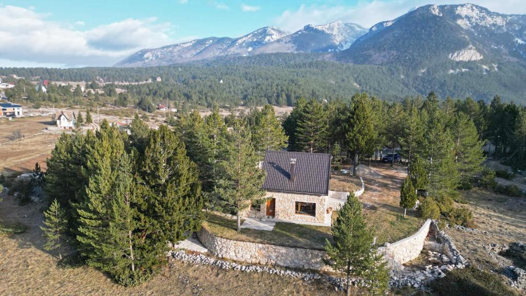 an aerial view of a house in the mountains at Boroviti Mountain House in Blidinje