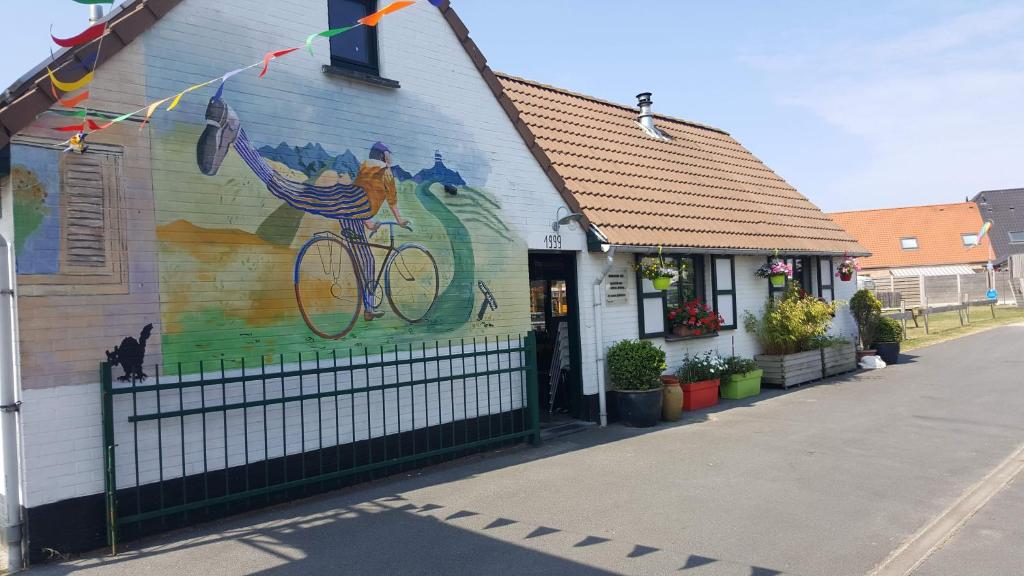 a building with a painting on the side of it at Vakantie verblijf in Bredene