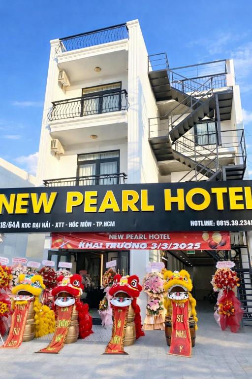 a new pearl hotel sign in front of a building at New Pearl Hotel HCM in Ho Chi Minh City