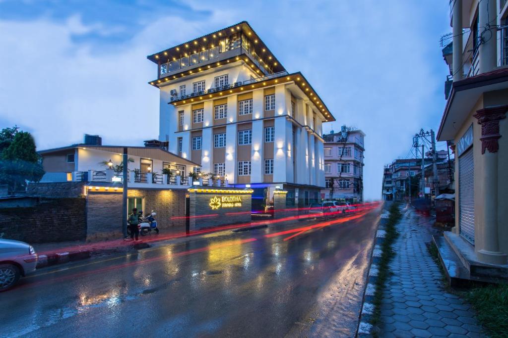a building with lights on it on a city street at Boudha Boutique Hotel in Kathmandu