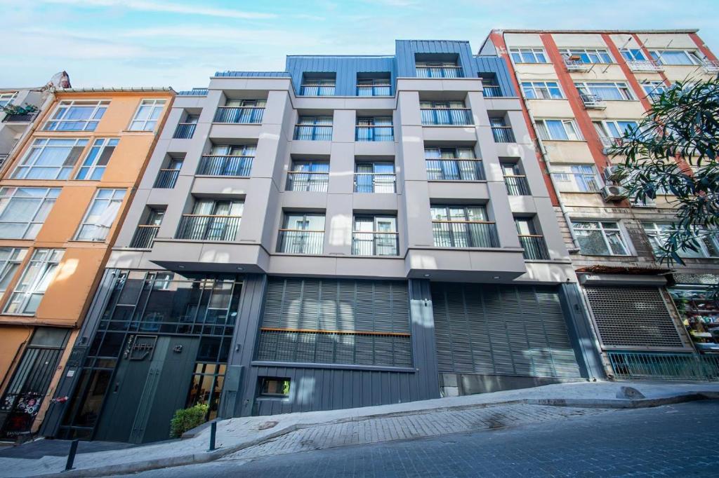 an apartment building in a city with many windows at Hay Rezidans in Istanbul