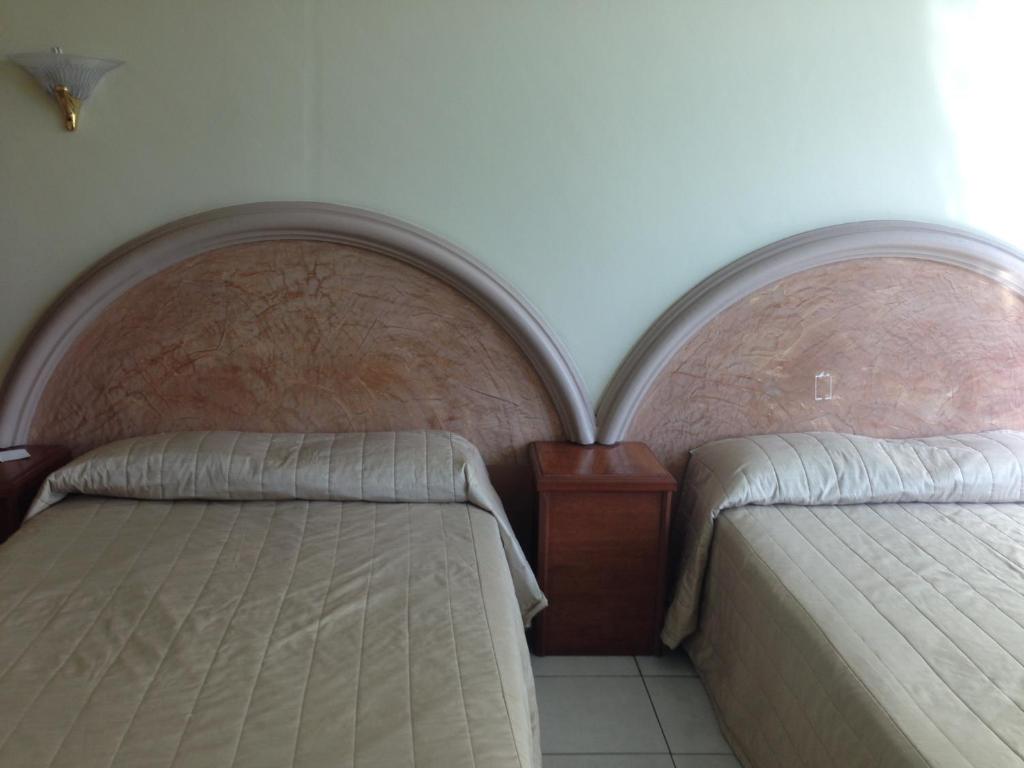 Postel nebo postele na pokoji v ubytování Hotel Plaza Sahuayo