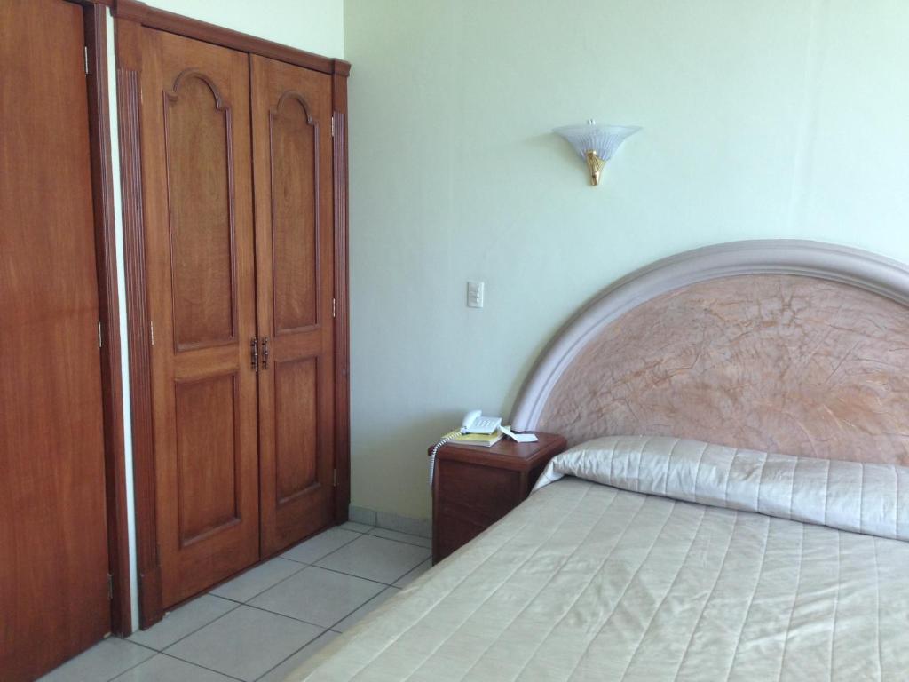 Postel nebo postele na pokoji v ubytování Hotel Plaza Sahuayo