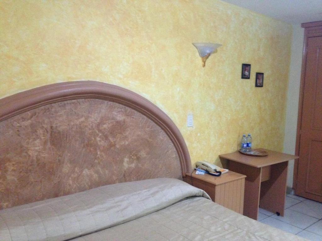 Postel nebo postele na pokoji v ubytování Hotel Plaza Sahuayo