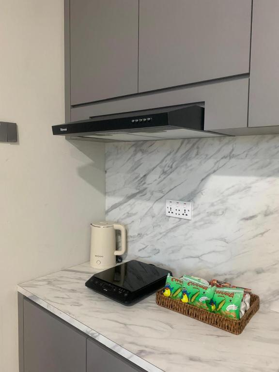 a kitchen with a counter with a coffee maker on it at Skyline Z in Mantaak