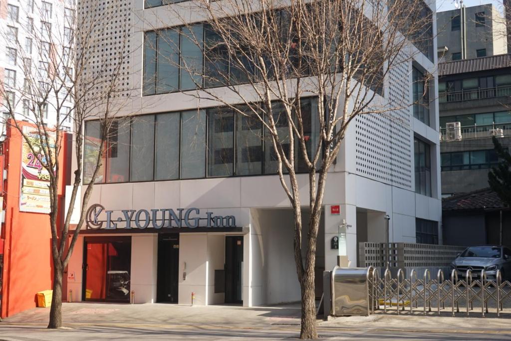 a building with a sign that reads saving the environment at L YOUNG Inn Capsule Hotel Myeongdong in Seoul