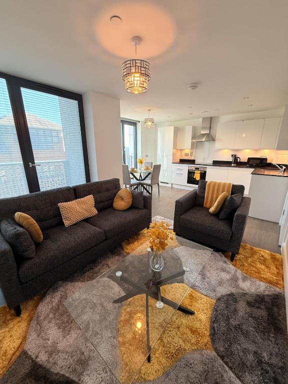 a living room with a couch and a table at Grace House in St. Albans