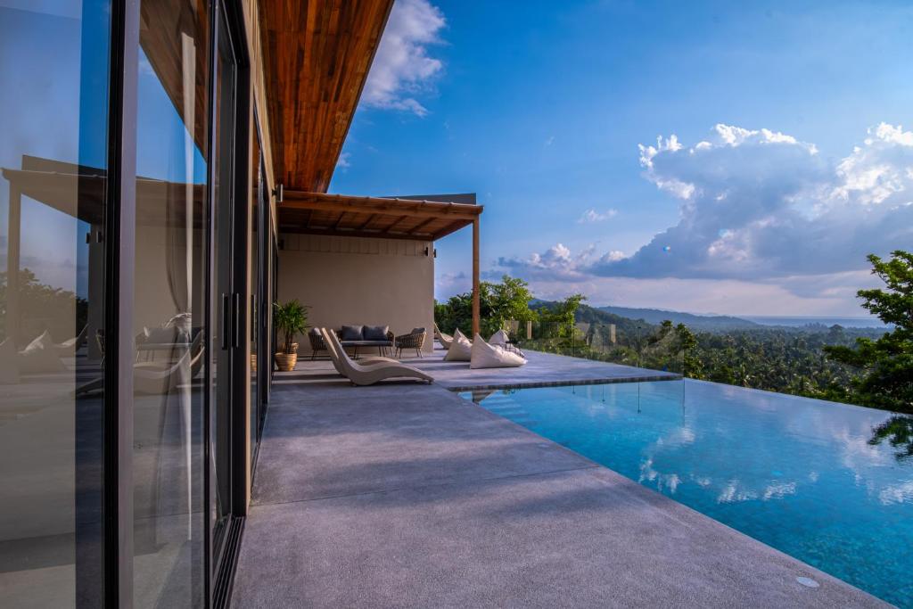 a house with a swimming pool with a view at InnSpire Villa - Breathtaking Sunset View in Hinkong