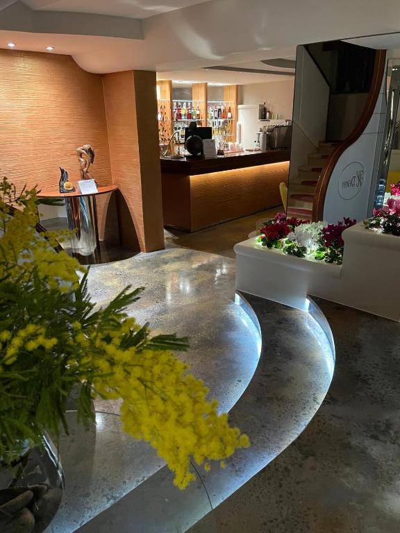 a room with flowers on a table in a store at Hotel Derby in Bellaria-Igea Marina