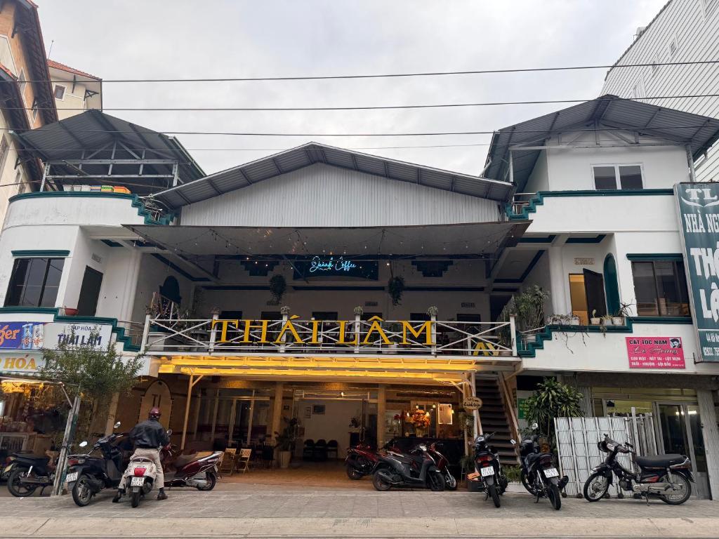 a group of motorcycles parked in front of a building at Thái Lâm Hotel in Da Lat