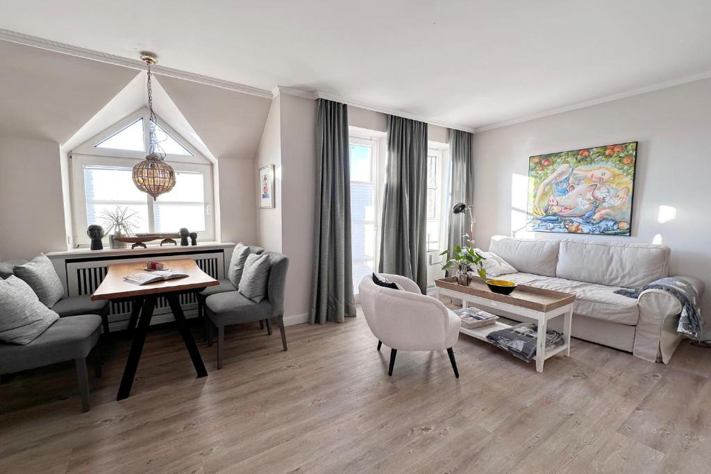 a living room with a couch and a table at Wohnung 9 in Westerland