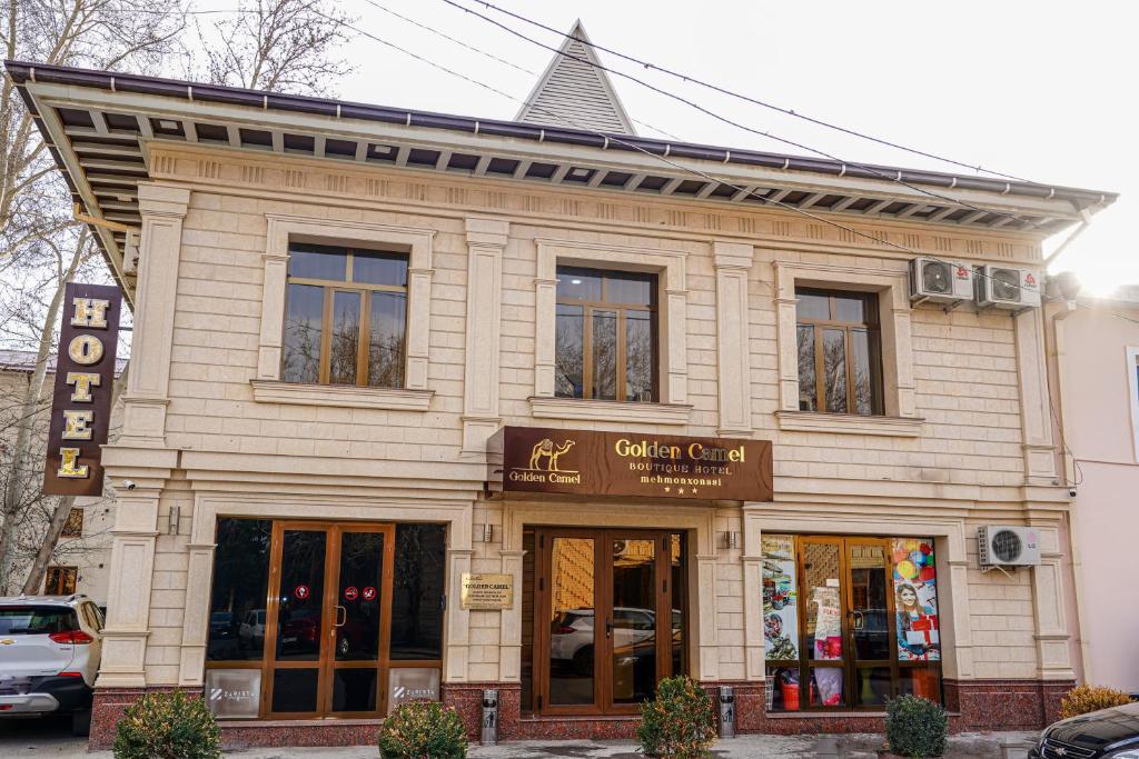 a store front of a building on a street at Gold Camel Registan in Samarkand