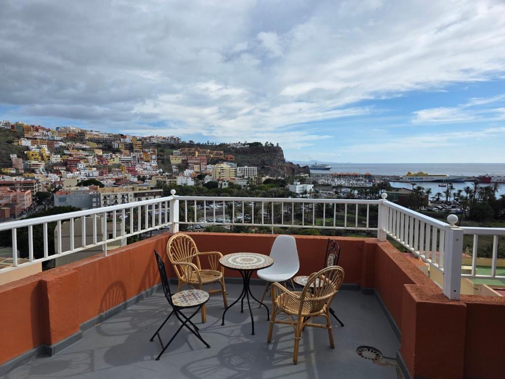 a balcony with a table and chairs and a view at apartamentos la villa in San Sebastián de la Gomera