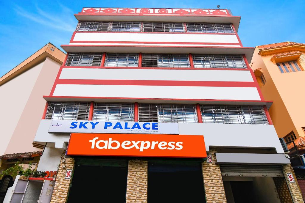 a tall building with a sign that reads sky palace tabacco interest at FabHotel Vhyom Sky Palace in Kolkata
