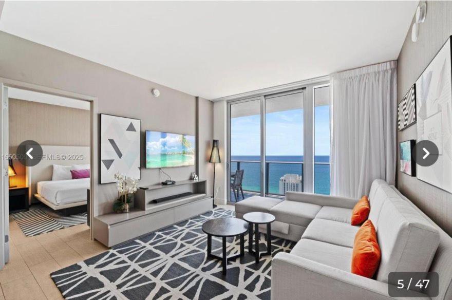 a living room with a couch and a tv at Hyde house 3507 AL MAR in Hollywood