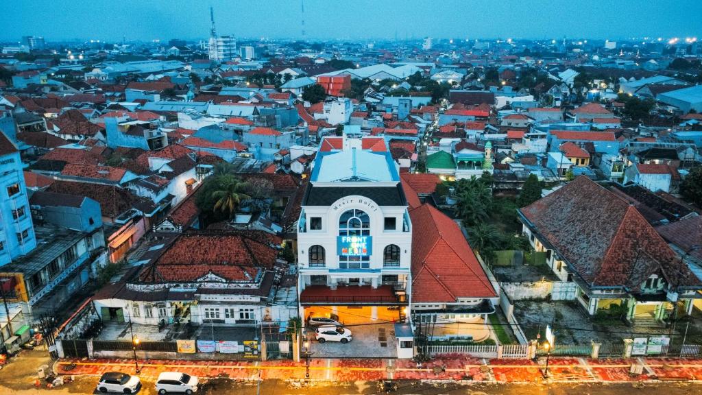 an overhead view of a city with buildings at Front One Hotel Mesir Surabaya in Surabaya