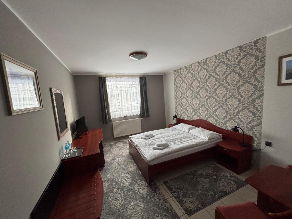 Llit o llits en una habitació de Hotel Ava