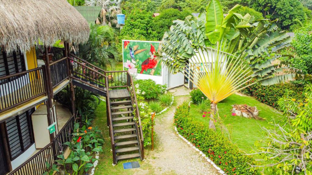 an overhead view of a garden with a spiral staircase at Hostal El Bohío in Palomino
