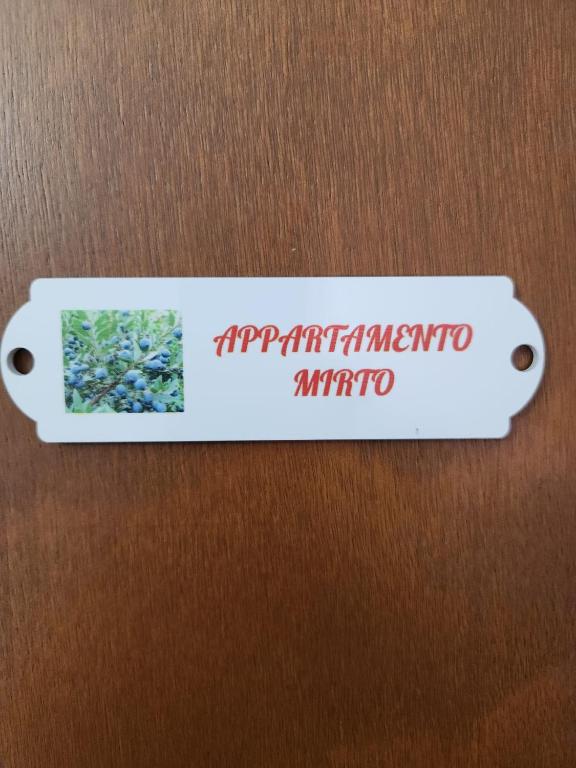 a label on a door with the wordsynchronousmethod sqor at Casa Wanda IL MIRTO in Oristano