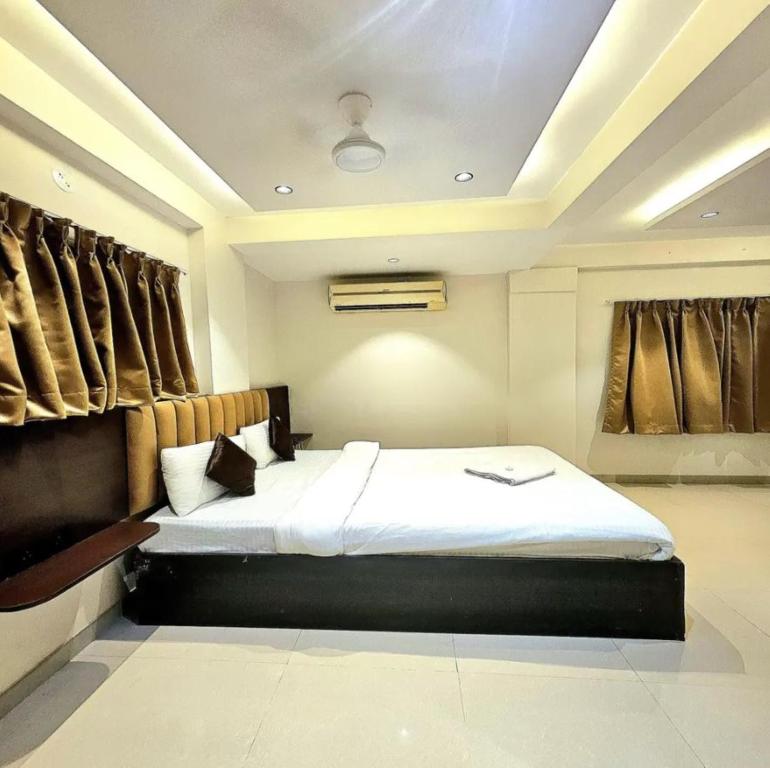 a bedroom with a large bed in a room at The Lotus in Pune