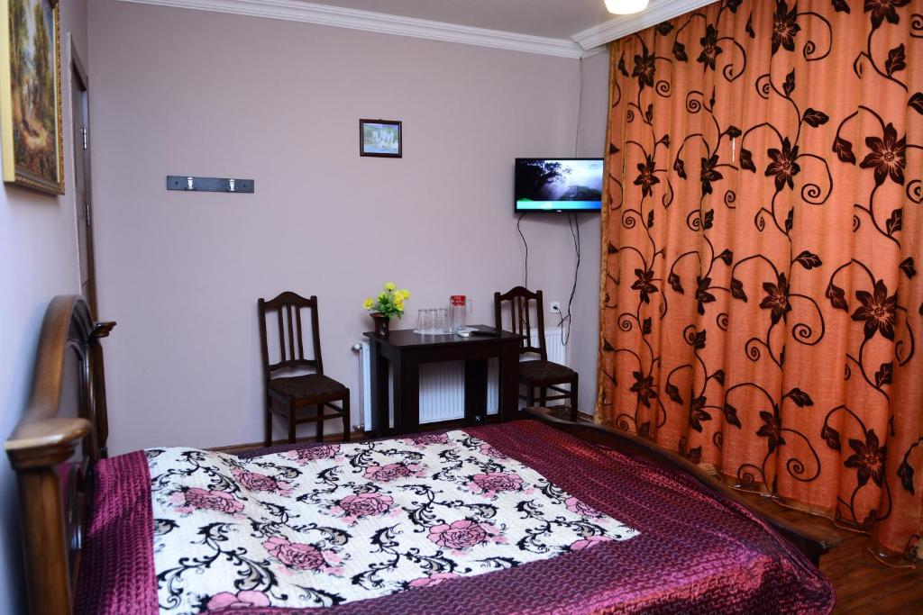Postel nebo postele na pokoji v ubytování Hotel Kvareli