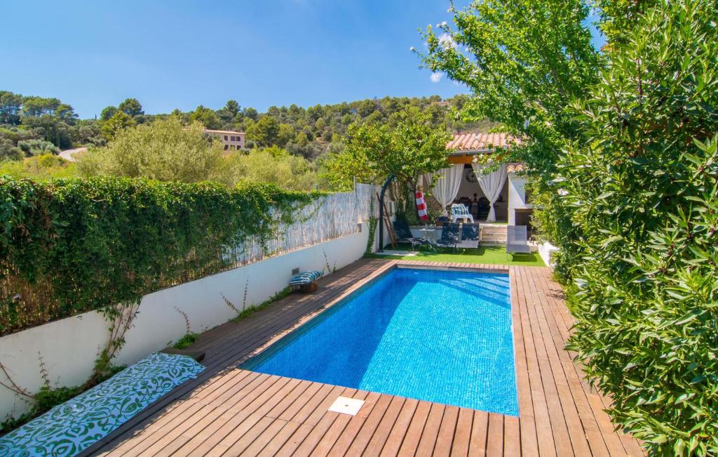 a swimming pool in the backyard of a house at Casa Gema in El Port de la Selva