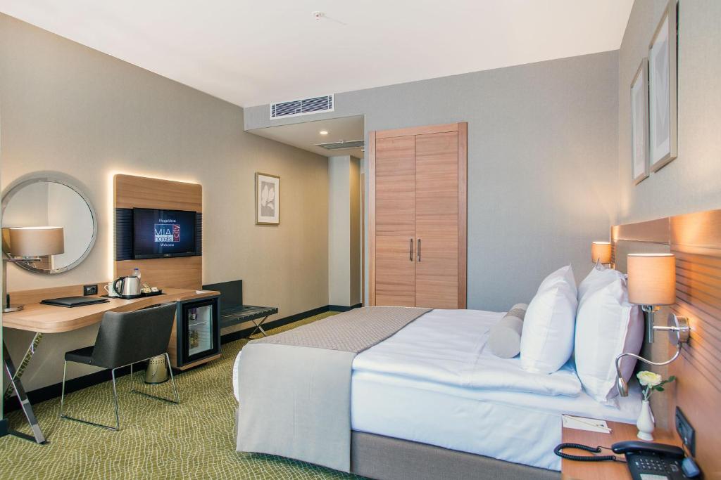 TV a/nebo společenská místnost v ubytování Mia City Hotel