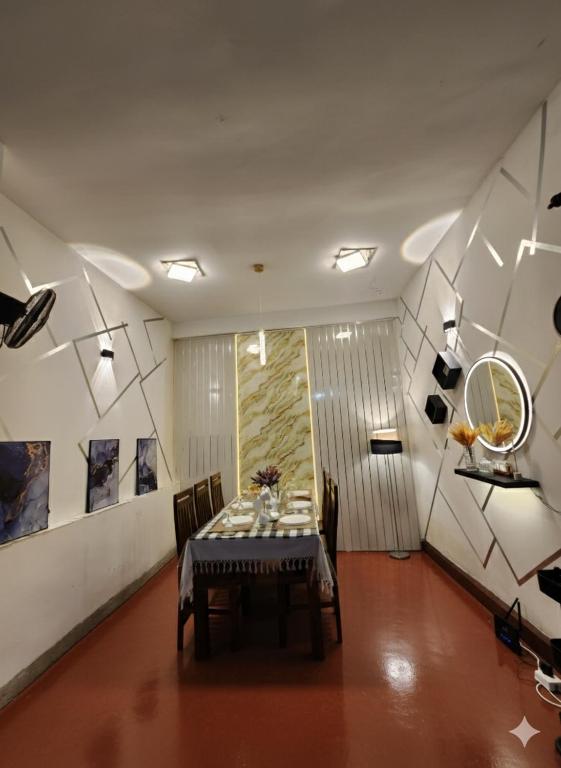 a dining room with a table in a room at HA Homes in Matale