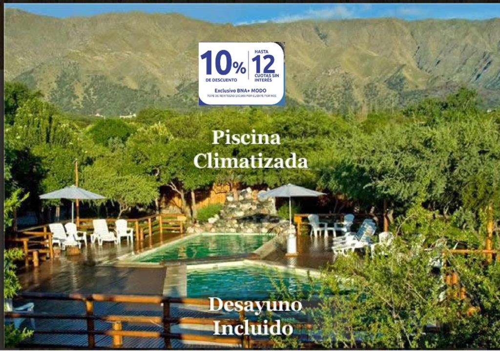 a price sign for a resort with a swimming pool at Rincón de los Troncos in Merlo