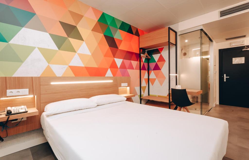 Lova arba lovos apgyvendinimo įstaigoje Vértice Roomspace